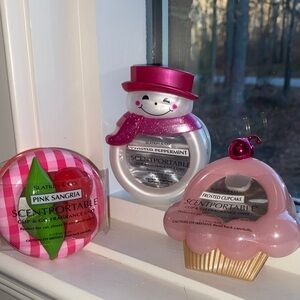 Three Bath & Body Works Scentportable clip and go fragrance units.